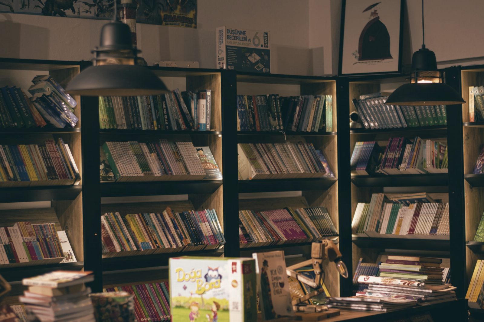 Warmly lit bookshelves create a cozy ambience in this inviting bookstore interior.